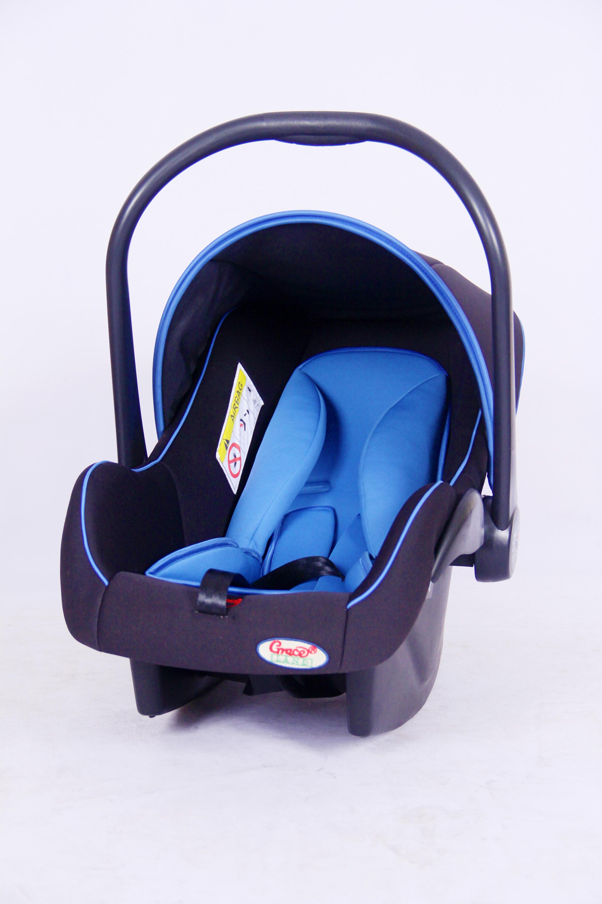 A blue 4-in-1 carry cot with the sun cover raised