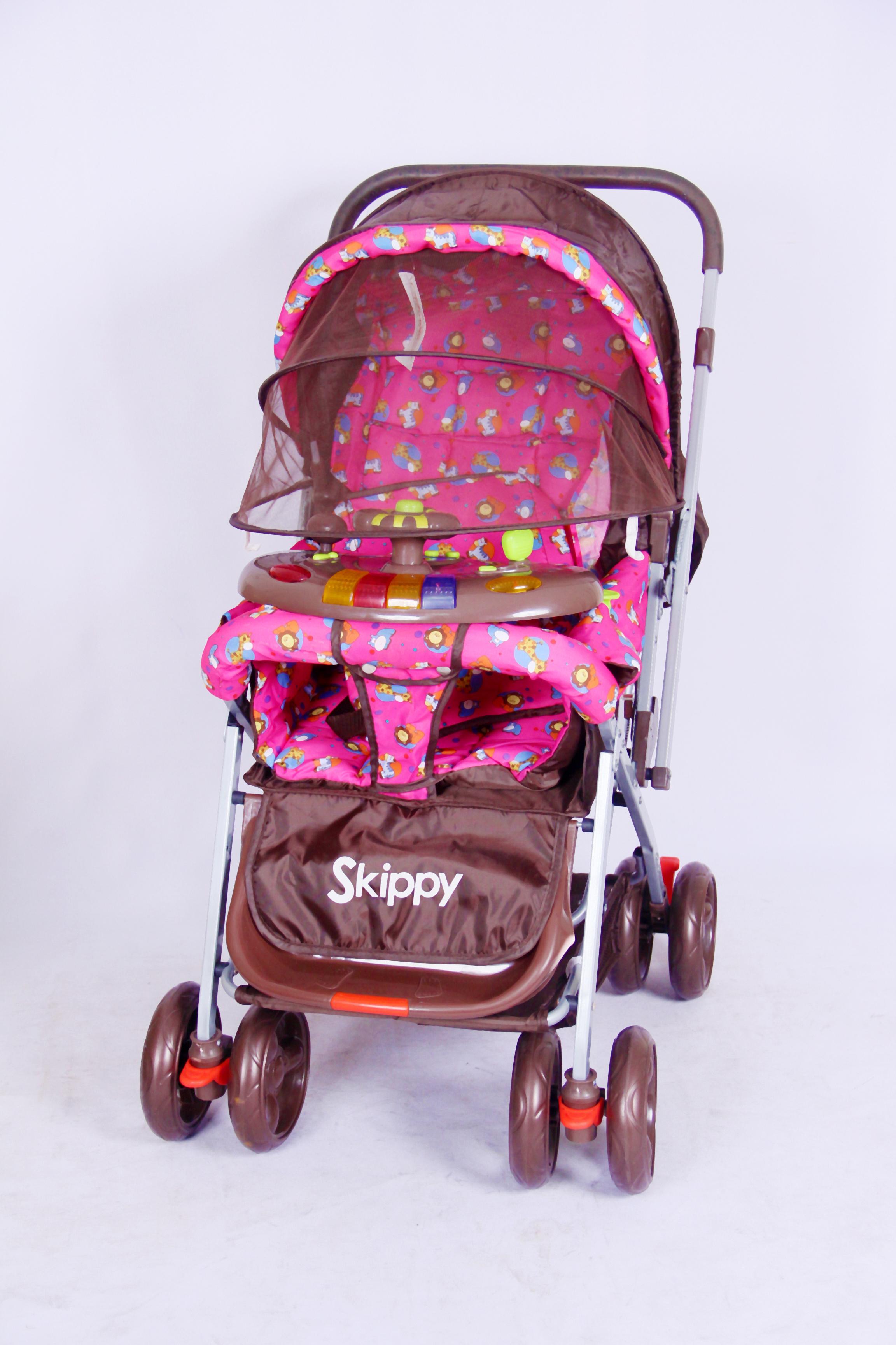 A foldable baby stroller with a reversible handle and a storage basket